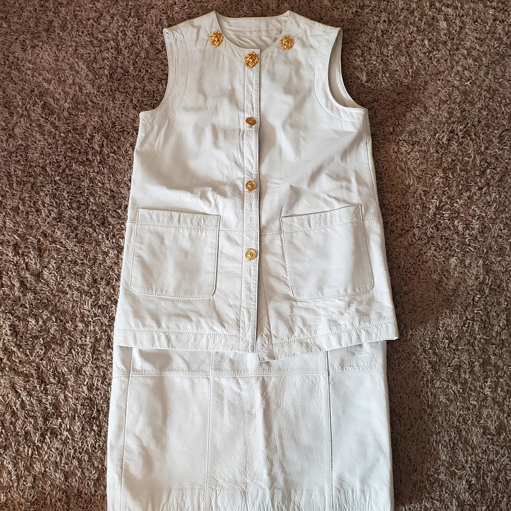 White leather matching vest and skirt set.